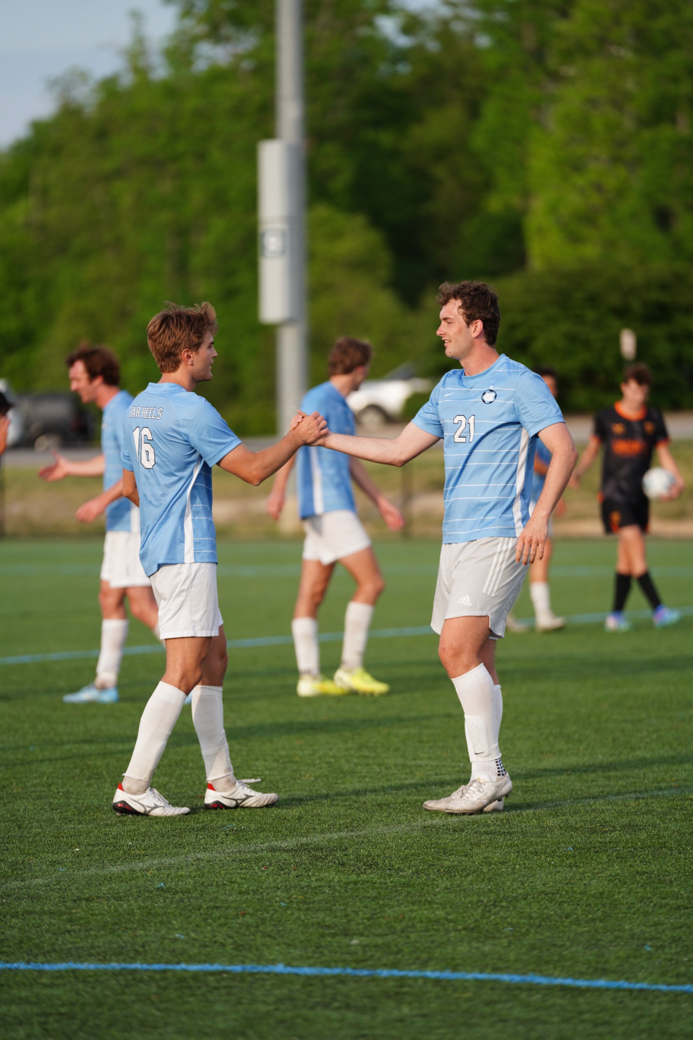 UNC teammates congratulating each other